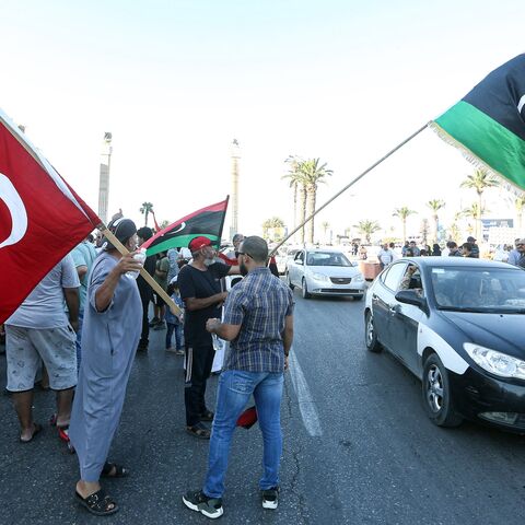 People wave flags of Libya (R) and Turkey (L) during a demonstration in the Martyrs' Square in the center of the Libyan capital Tripoli on June 21, 2020.