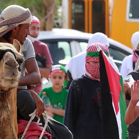 Supporters of Jordan's Muslim Brotherhood take part in a protest in the village of Sweimeh.