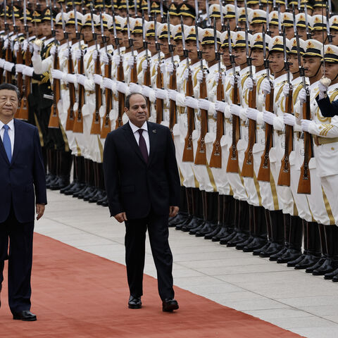 BEIJING, CHINA - MAY 29: Chinese President Xi Jinping walks next to Egyptian President Abdel Fattah al-Sisi (C) review the honour guard during a welcome ceremony for Egyptian President Abdel Fattah al-Sisi at the Great Hall of the People on May 29, 2024 in Beijing, China. (Photo by Tingshu Wang-Pool/Getty Images)