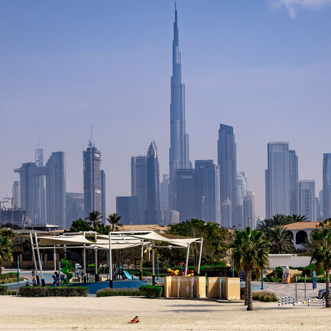 Burj Khalifa, the world's tallest building, adorns the Dubai skyline as people sunbathe on Jumerah beach, Dubai, United Arab Emirates, Jan. 30, 2025.