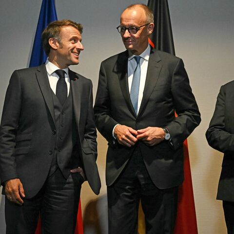 French President Emmanuel Macron, German Chancellor Friedrich Merz and British Prime Minister Keir Starmer pose for the media at a hotel prior to an E3 meeting on the sidelines of the 2025 NATO summit on June 24, 2025, in The Hague, Netherlands. 