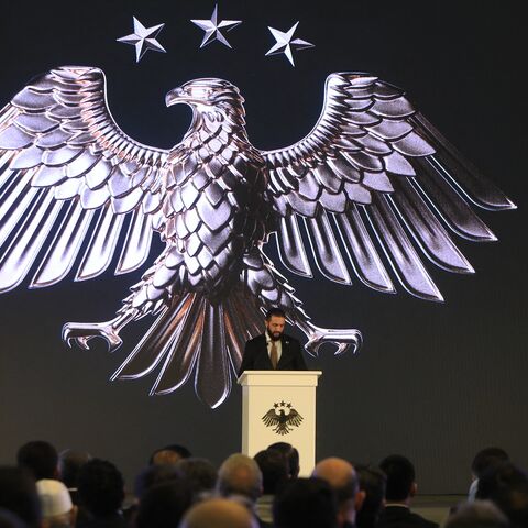 Syrian President Ahmad Al-Sharaa delivers a speech at the presidential palace during the unveiling of the country's new national emblem, Damascus, July 3, 2025. 