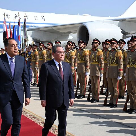 Egypt's Prime Minister Mustafa Madbouly (L) welcomes China's Premier Li Qiang upon his arrival at Cairo International Airport in Egypt's capital, on July 9, 2025.