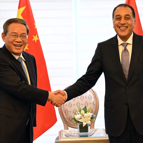 Egypt's Prime Minister Mostafa Madbouly (R) meets with China's Premier Li Qiang at his office in Cairo on July 10, 2025. 