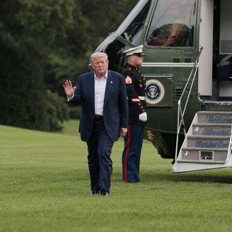 WASHINGTON, DC - JULY 29: U.S. President Donald Trump walks across the South Lawn of the White House followed by granddaughter Chloe after returning on Marine One on July 29, 2025 in Washington, DC. President Trump returned to the White House with his family after a trip to Scotland that was part vacation, part work, as he stayed at his Trump Turnberry golf course, followed by Trump International Golf Links in Aberdeenshire, from July 25 to 29. (Photo by Anna Moneymaker/Getty Images)