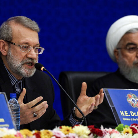 IRAN-SANCTION-DIPLOMACY-POLITICS Iran's Parliament Speaker Ali Larijani (L) speaks while seated next to President Hassan Rouhani, during the 2nd Speaker's Conference, which includes delegations from Afghanistan, China, Pakistan, Turkey, and Russia and focuses on terrorism and regional cooperation, in the capital Tehrnan on December 8, 2018. Rouhani said US sanctions were "economic terrorism", as he sought to foster a united front from visiting regional officials on December 8. Addressing parliament speakers