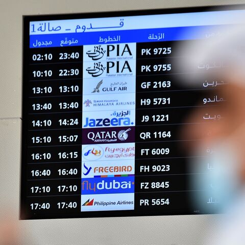 People wait for the arrival of relatives at King Khalid International Airport in the Saudi capital of Riyadh on the first commercial flight from Qatar on Jan. 11, 2021. 