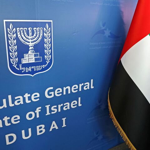 The national flags of the United Arab Emirates (L) and Israel are set side by side at the new Israeli consulate of Dubai ahead of a press conference by Israel's foreign minister on June 30, 2021.