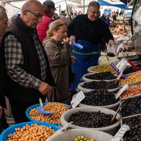 People shop at a local street market in Istanbul, Turkey, May 3, 2023.