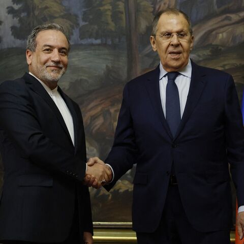 Russia's foreign minister, Sergei Lavrov (R), shakes hands with Iran's foreign minister, Abbas Araghchi (L), during a joint press conference following their talks in Moscow on April 18, 2025.