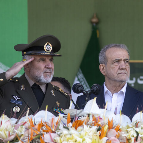 Iranian President Masoud Pezeshkian (R) makes a speech as he attends the National Army Day ceremony on April 18, 2025 in Tehran, Iran. 