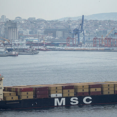 A container ship passes in front of Haydarpasa Port as it navigates the Bosphorus Strait on May 2, 2025 in Istanbul, Turkey.