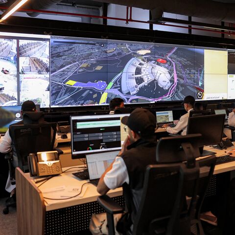 Employees man their terminals at the control room for traffic and crowd management for pilgrims at the General Transport Centre at the Royal Commission for Mecca and Holy Sites in Mecca on June 3, 2025.
