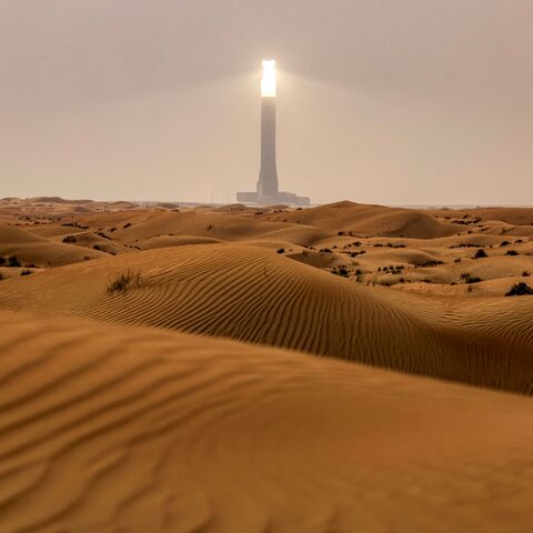 The tallest solar power tower in the world at 260 metres is pictured at the concentrated solar thermal power (CST) Noor Energy 1 solar complex at Mohammed bin Rashid al-Maktoum Solar Park, about 50 kilometres south of Dubai, on July 19, 2025. (Photo by FADEL SENNA / AFP) (Photo by FADEL SENNA/AFP via Getty Images)