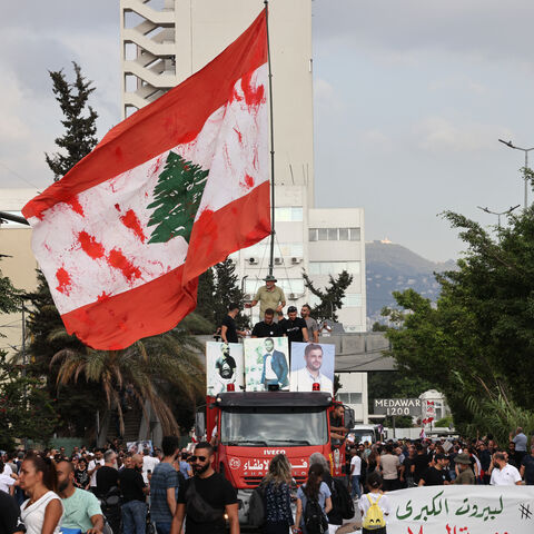 Lebanese demonstrators march during a gathering to honour the victims of the catastrophic port explosion in 2020 and to call for accountability for the blast, in Beirut on August 4, 2025. Lebanese President Joseph Aoun on August 4, vowed justice and accountability five years after a catastrophic explosion at Beirut's port, as the investigating judge finished questioning defendants, a judicial official said. (Photo by ANWAR AMRO / AFP) (Photo by ANWAR AMRO/AFP via Getty Images)