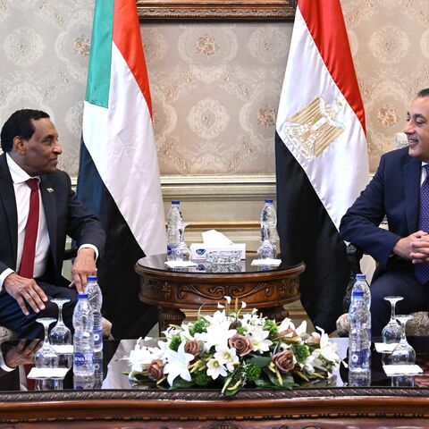 Egypt's prime minister, Mostafa Madbouly (R), meets with his counterpart from Sudan, Kamil Idris, upon his arrival in Egypt's capital, Cairo, on Aug. 7, 2025.