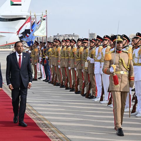 Egypt's prime minister, Mostafa Madbouly (L), welcomes his counterpart from Sudan, Kamil Idris, upon his arrival at the Cairo International Airport in Egypt's capital on Aug. 7, 2025. 