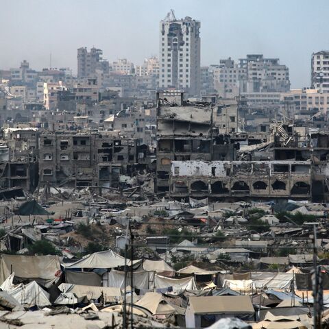 Tents used as temporary shelters by displaced Palestinians are set up near war-damaged buildings in Gaza City on Aug. 8, 2025.