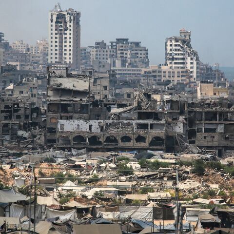 Buildings destroyed in Israeli strikes surround makeshift shelters for displaced Palestinians in Gaza City, on Aug. 8, 2025.