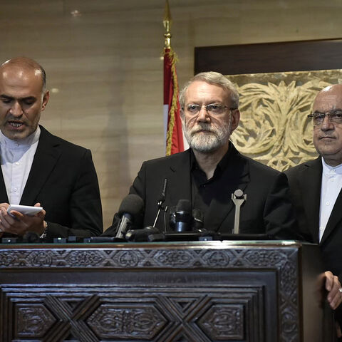 Iran's Supreme National Security Council chief Ali Larijani (C) speaks to reporters after meeting with Lebanon's parliament speaker in Beirut on Aug. 13, 2025.