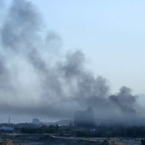 Smoke billows over a neighborhood of Sulaimaniyah, east of the autonomous Kurdistan region of Iraq, after security forces arrested opposition figure Lahur Sheikh Jangi, following several hours of armed clashes on Aug. 22, 2025.