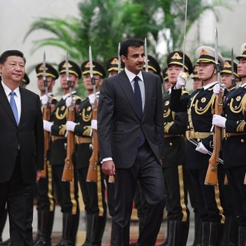 Qatar's Emir Tamim bin Hamad al-Thani (C) reviews a military honour guard with Chinese President Xi Jinping (L) during a welcoming ceremony in Beijing's Great Hall of the People on January 31, 2019. (GREG BAKER/AFP via Getty Images)
