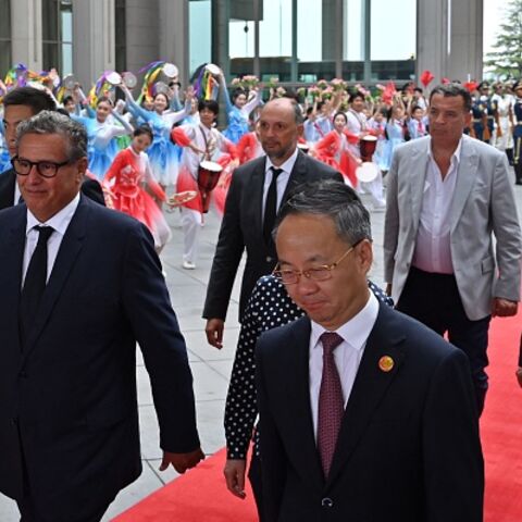 Morocco Prime Minister Aziz Akhannouch (L) walks with officials upon arriving at the Beijing Capital International airport in Beijing on September 4, 2024. (ADEK BERRYADEK BERRY/AFP via Getty Images)