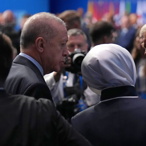 President Donald Trump (R) speaks with President of the Republic of Turkey, Recep Tayyip Erdogan (L), as they arrive for the North Atlantic Council Plenary Session on the second day of the 2025 NATO Summit on June 25, 2025 in The Hague, Netherlands. 