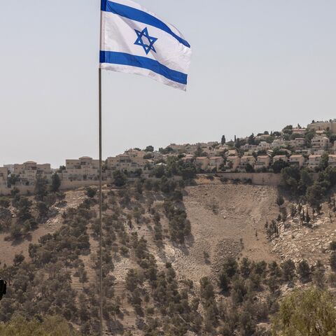 Israeli policemen stand guard near the settlement of Maale Adummim, in a land corridor known as E1, outside Jerusalem in the occupied West Bank on Aug. 14, 2025.