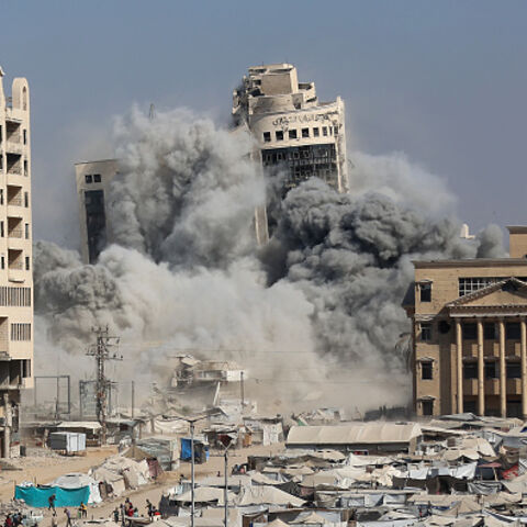 The al-Ruya Tower in Gaza City's Rimal area collapses amidst smoke after Israeli bombardment, on September 8, 2025, following Israel's announcement that it would target tall buildings identified as being used by Hamas ahead of its forces' planned conquest of the urban hub. Israel has been warning for weeks of a new assault on the territory's largest city, without issuing a timeline. It has stepped up air strikes and ground operations on the city's outskirts, sparking fears it could worsen already dire condi