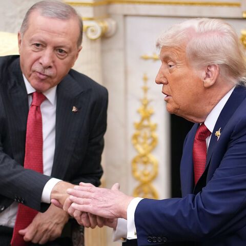 President Donald Trump (R) shakes hands with President of Turkey Recep Tayyip Erdogan during a meeting in the Oval Office at the White House on Sept. 25, 2025 in Washington, DC.