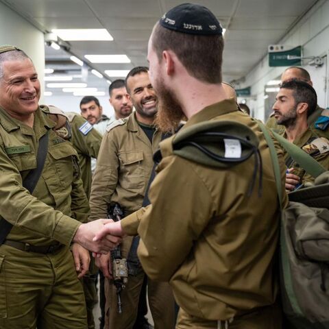 Maj. Gen. David Zini, head of the Israeli military Training Command (left), greets an ultra-Orthodox soldier drafted into the  Hasmonean Brigade, Jan. 5, 2025.