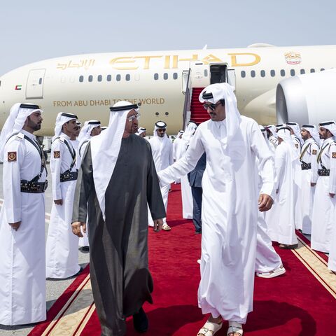 Sheikh Tamim bin Hamad Al Thani (L) welcomes Sheikh Mohammed Bin Zayed Al Nahyan (R) to Hamad International Airport in Doha, on Sept. 10, 2025.