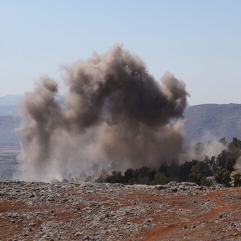 This picture taken on Aug. 20, 2021 shows a view of smoke rising from bombardment on the outskirts of Syria's rebel-held northwestern city of Idlib. 