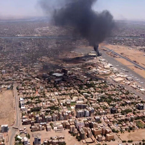This image grab taken from AFPTV video footage on April 20, 2023, shows an aerial view of black smoke rising above the Khartoum International Airport amid ongoing battles between the forces of two rival generals.