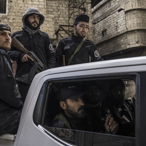 Syria's internal security forces are deployed in Tadamon to secure a protest in Tadamon, Syria, on Feb. 7, 2025.