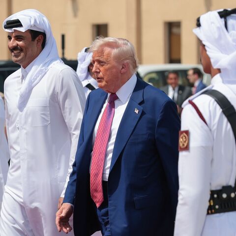 US President Donald J. Trump speaks with Emir of Qatar Sheikh Tamim bin Hamad Al Thani as he departs the Al Udeid Air Base for Abu Dhabi on May 15, 2025, in Doha, Qatar. 