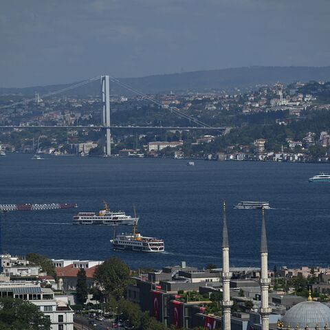 Ferries sail on Bosphorus in Istanbul, on August 29, 2025, next to the 15 July Martyrs Bridge, known as Bosphorus bridge. 