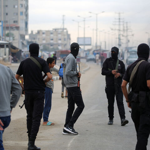 Members of the internal security forces loyal to the Palestinian group Hamas, man a checkpoint in the Nuseirat refugee camp in the central Gaza Strip, on Oct. 12, 2025. 