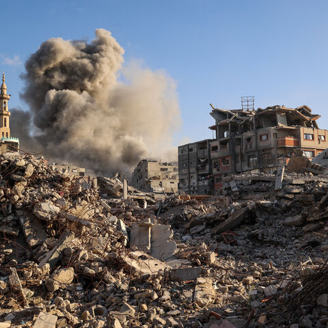 Smoke billows following an Israeli strike that targeted a building in the Bureij camp for Palestinian refugees in the central Gaza Strip on Oct. 19, 2025.