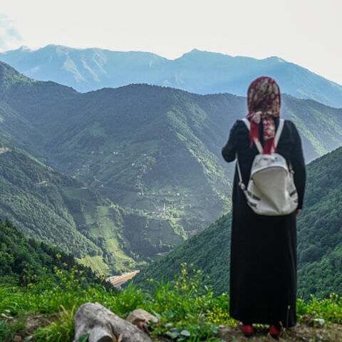 A villager stands at a high point to survey the damage to the hill sides by quarrying in Ikizdere in the Rize Province in the Black Sea region of Turkey on June 7, 2021. A government-friendly company plans to extract 20 million tons of stone from a quarry in the northeastern town of Ikizdere for one of President Recep Tayyip Erdogan's latest development projects. The locals are rising up in protest, challenging the government and its priorities in a region dear to the domineering Turkish leader's heart. (Ph