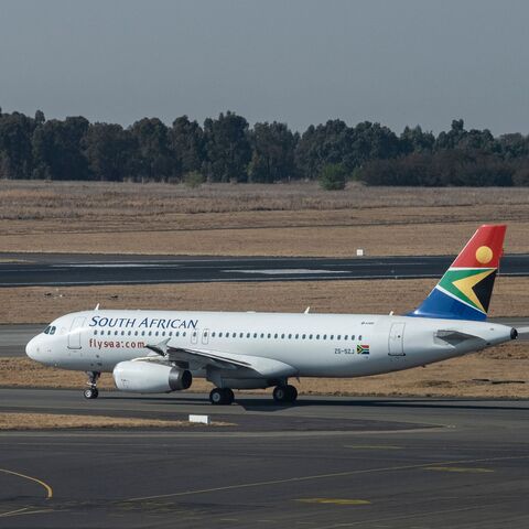 A South African Airways (SAA) flight is seen on the tarmac before departing from the O.R. Tambo International Airport in Johannesburg on Sept. 23, 2021. 