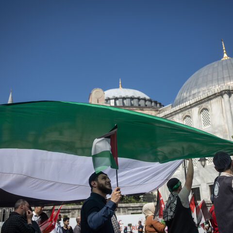 ISTANBUL, TURKEY - JUNE 01: People carry a large Palestinian flag during a protest to express support for Palestinians in Gaza outside the Hagia Sophia Grand Mosque on June 01, 2025 in Istanbul, Turkey. Protests continue as talks between Hamas, Israel and the U.S continue to seek a ceasefire deal and negotiate for a permanent end to the war. (Photo by Chris McGrath/Getty Images)