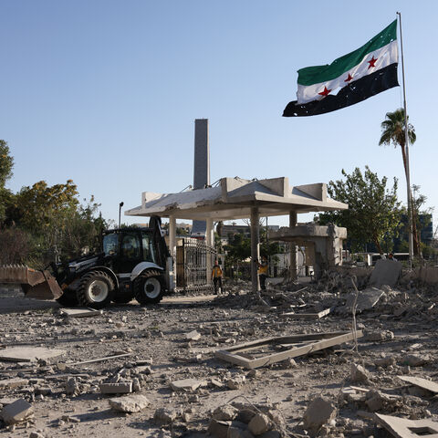 DAMASCUS, SYRIA - JULY 16: Members of Syria's civil defense work amid the aftermath of an Israeli airstrike on Syria's defence ministry headquarters on July 16, 2025 in Damascus, Syria. A spokesperson from the Israeli Defense Forces (IDF) confirmed Wednesday that Israeli airstrikes have targeted the headquarters of Syria's defence ministry and a site near the presidential palace in Damascus. The strikes come amid an escalation in conflict between Syrian government forces and Druze militia in the southern Sy