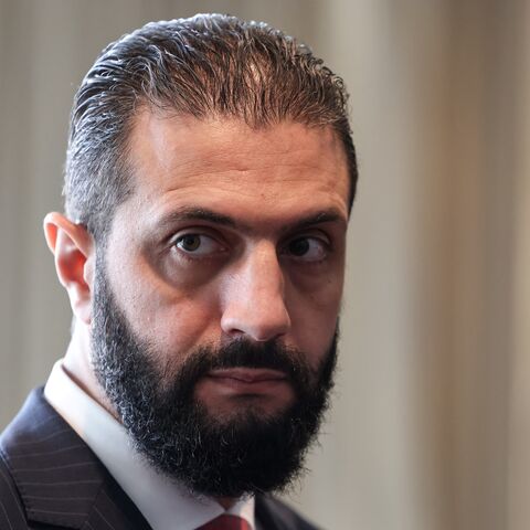 Syrian President Ahmed al-Sharaa waits to meet with France's president, Emmanuel Macron, on the sidelines of the United Nations General Assembly in New York City on Sept. 24, 2025.