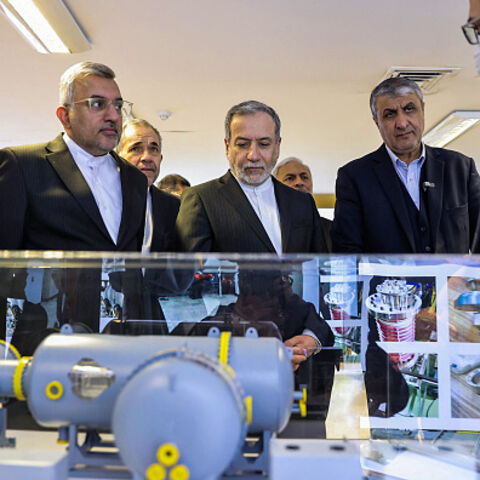 In this handout photo released by the Atomic Energy Organization of Iran (AEOI) on November 10, 2025, Iran's Foreign Minister Abbas Araqchi (L) is accompanied by AEOI chief Mohammad Eslami during a visit to a facility in Tehran. (Photo by Atomic Energy Organization of Iran / AFP)