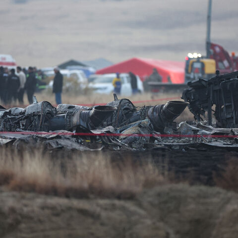 Wreckage is seen at the crash site of the Turkish C-130 military cargo plane in the Sighnaghi area at the Georgia-Azerbaijan border on November 12, 2025. A Turkish military cargo plane carrying 20 passengers and crew crashed in Georgia on its way home from Azerbaijan, the defence ministry said Tuesday. (Photo by Giorgi ARJEVANIDZE / AFP) (Photo by GIORGI ARJEVANIDZE/AFP via Getty Images)
