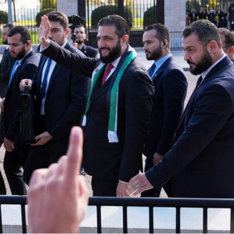 Syria's president, Ahmed al-Sharaa, greets supporters outside the White House on Nov. 10, 2025.