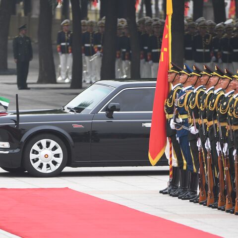 The Red Flag limousine carrying Abu Dhabi Crown Prince Mohammed bin Zayed passes a military honour guard as he arrives for a welcoming ceremony outside the Great Hall of the People in Beijing on July 22, 2019. (Photo by GREG BAKER / AFP) (Photo credit should read GREG BAKER/AFP via Getty Images)