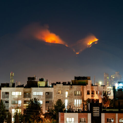 Smoke rises as fire burns, in an alleged site of IRGC's missile launch targeted by Israel on the mountains of Shiraz, Iran on June 21, 2025. Israel attacked Iran in early hours of June 13, and the exchange of fire between the two countries continues ever since. (Photo by Hiroon / Middle East Images via AFP) (Photo by HIROON/Middle East Images/AFP via Getty Images)
